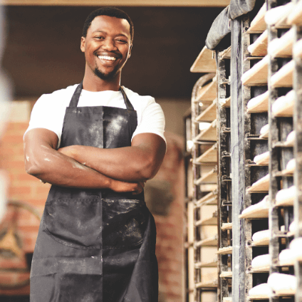 Baker in front of a rack