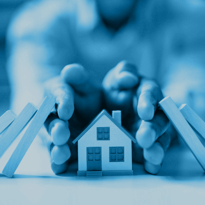 Hands protecting a home