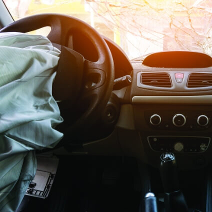 deployed airbag from car dashboard