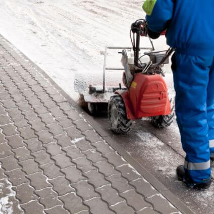 clearing walkway with snowblower